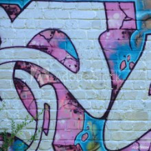 Picture of Fragment of graffiti drawings The old wall decorated with paint stains in the style of street art culture Colored background texture in purple tones